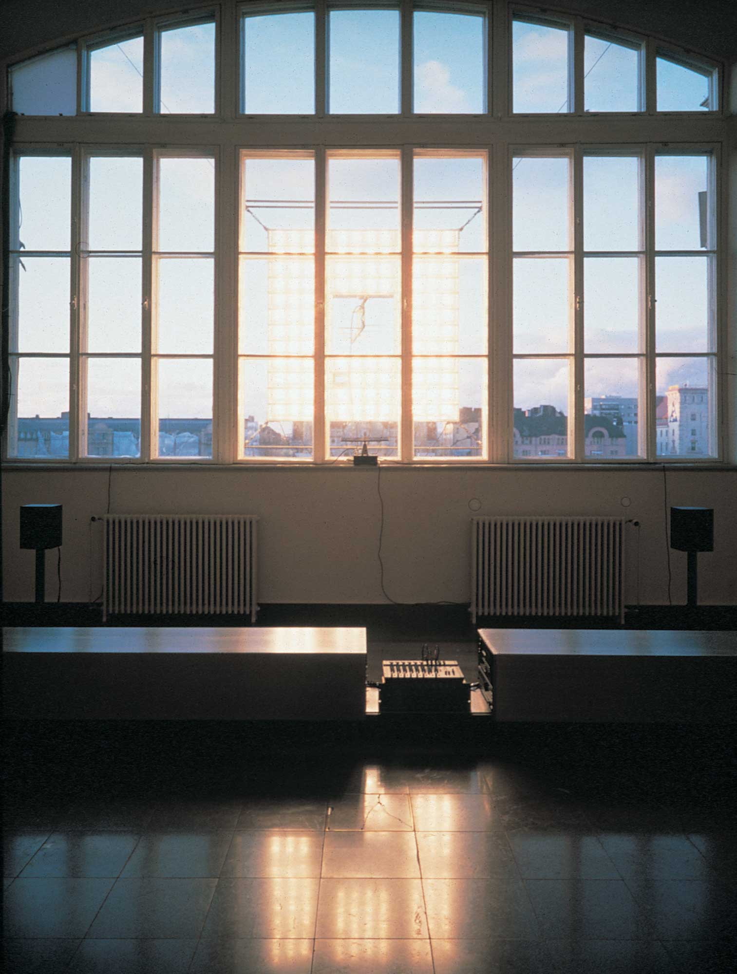 Ambient City – Radio Project: front view on artwork installed on window inside of art museum