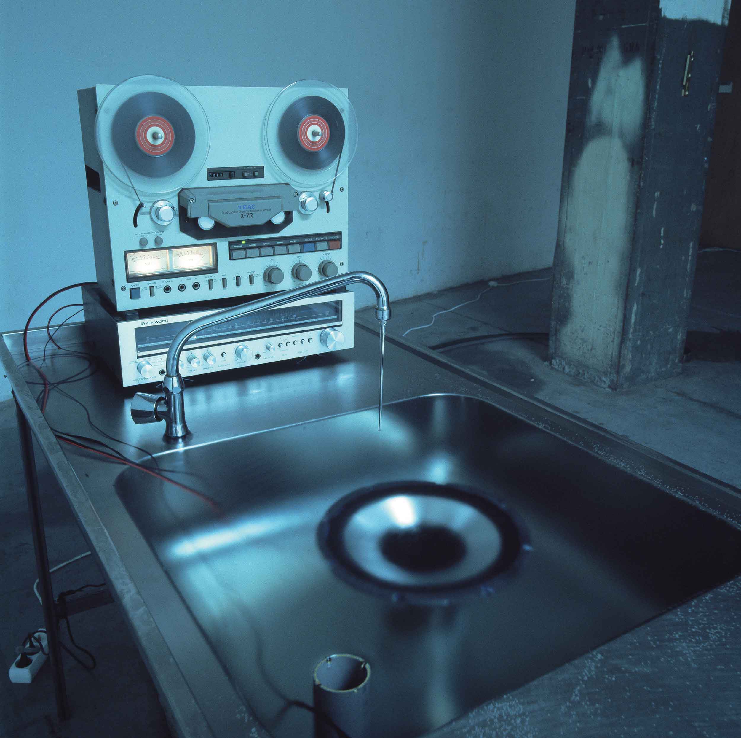 Grey Room Installation: close-up of sink and tape recorder