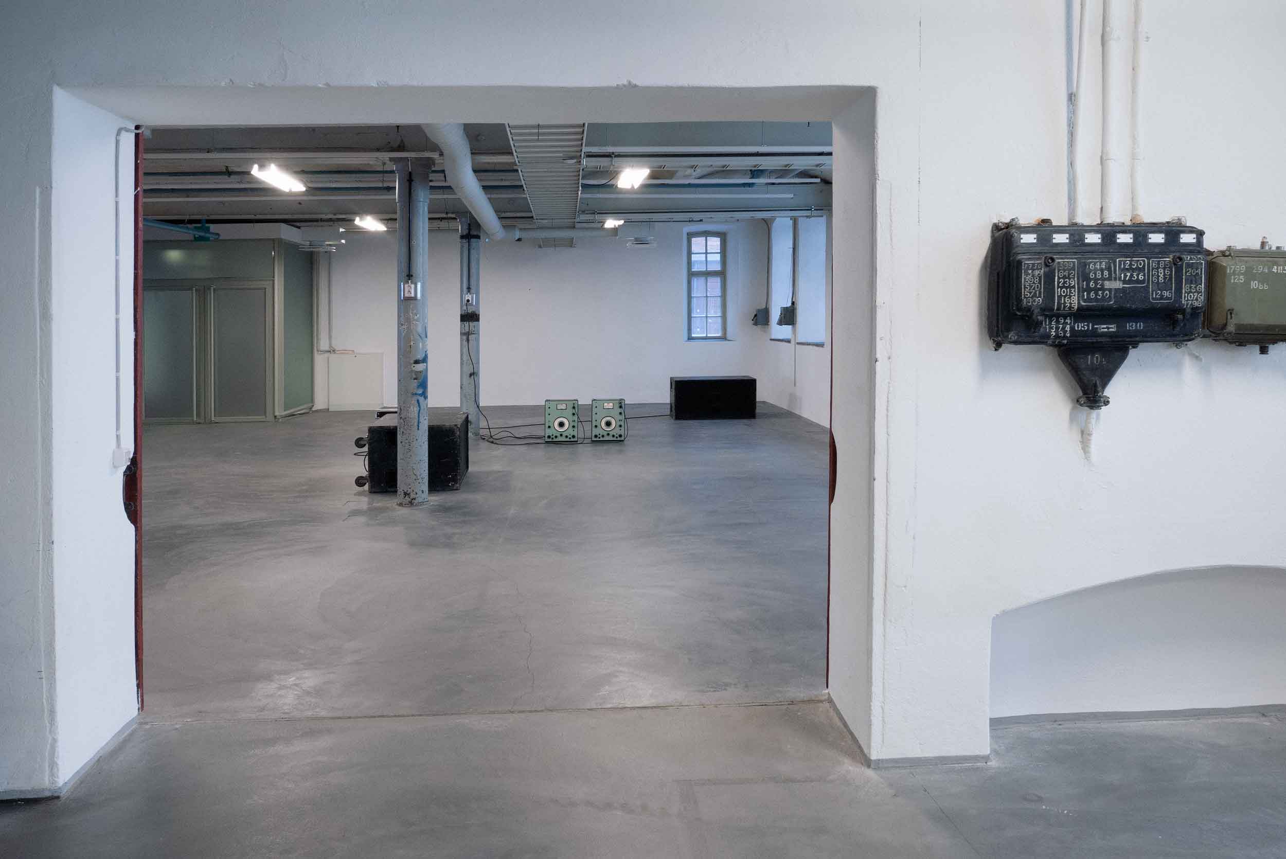 View on artwork and exhibition space through door