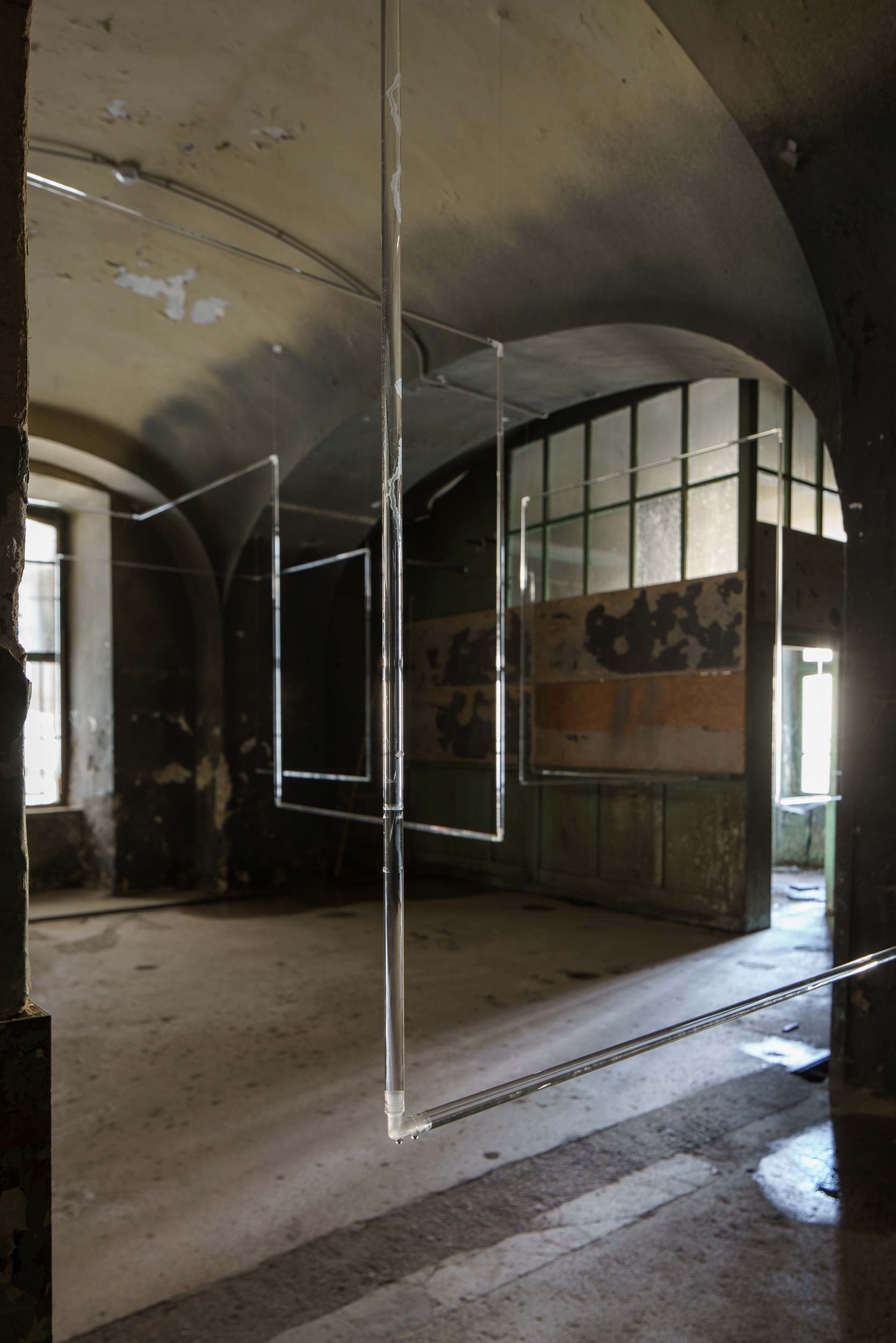 Imminence: glass tube in foreground with rest of installation structure in background