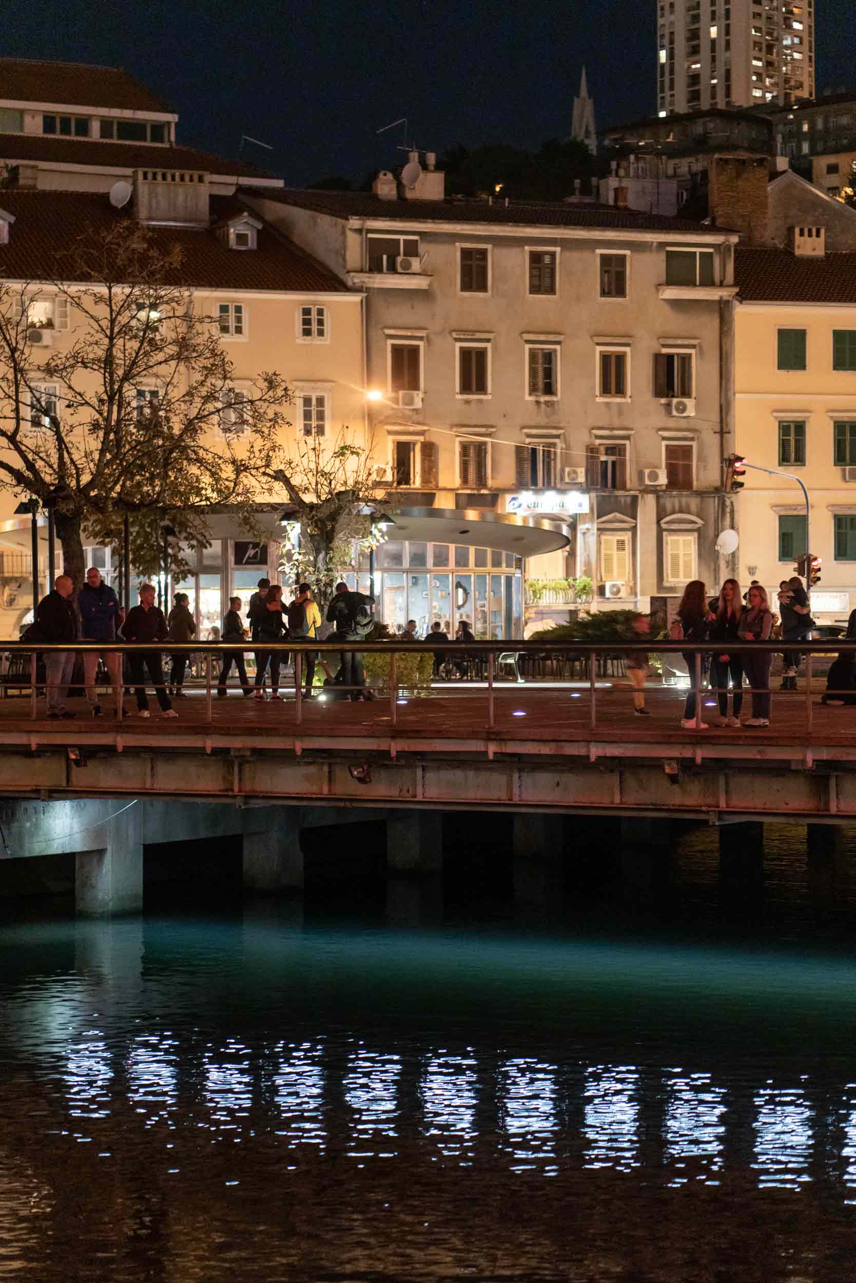 Time Slip: visitors standing on bridge with artwork underneath