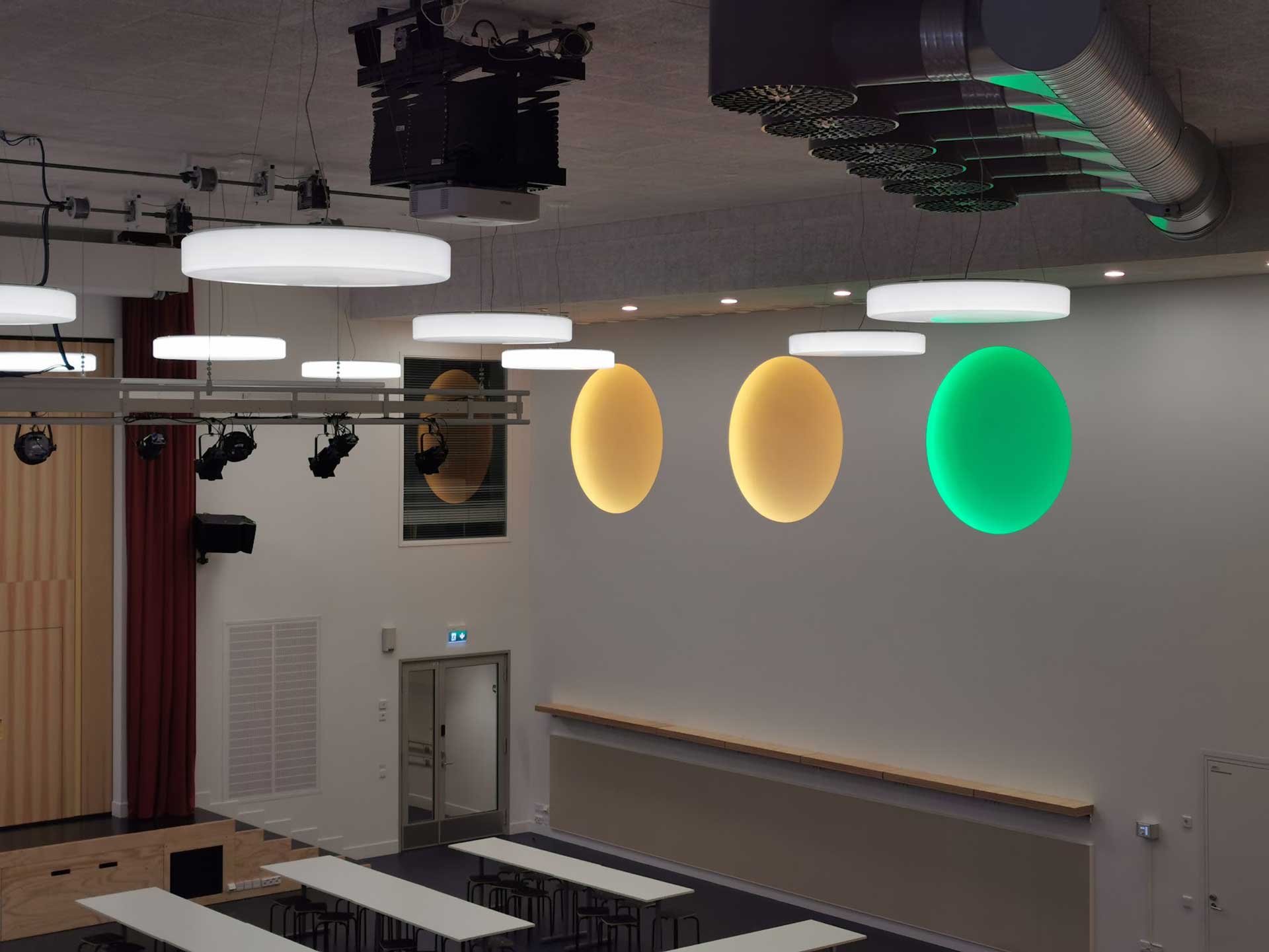 Side view on installation in lit yellow, yellow and green