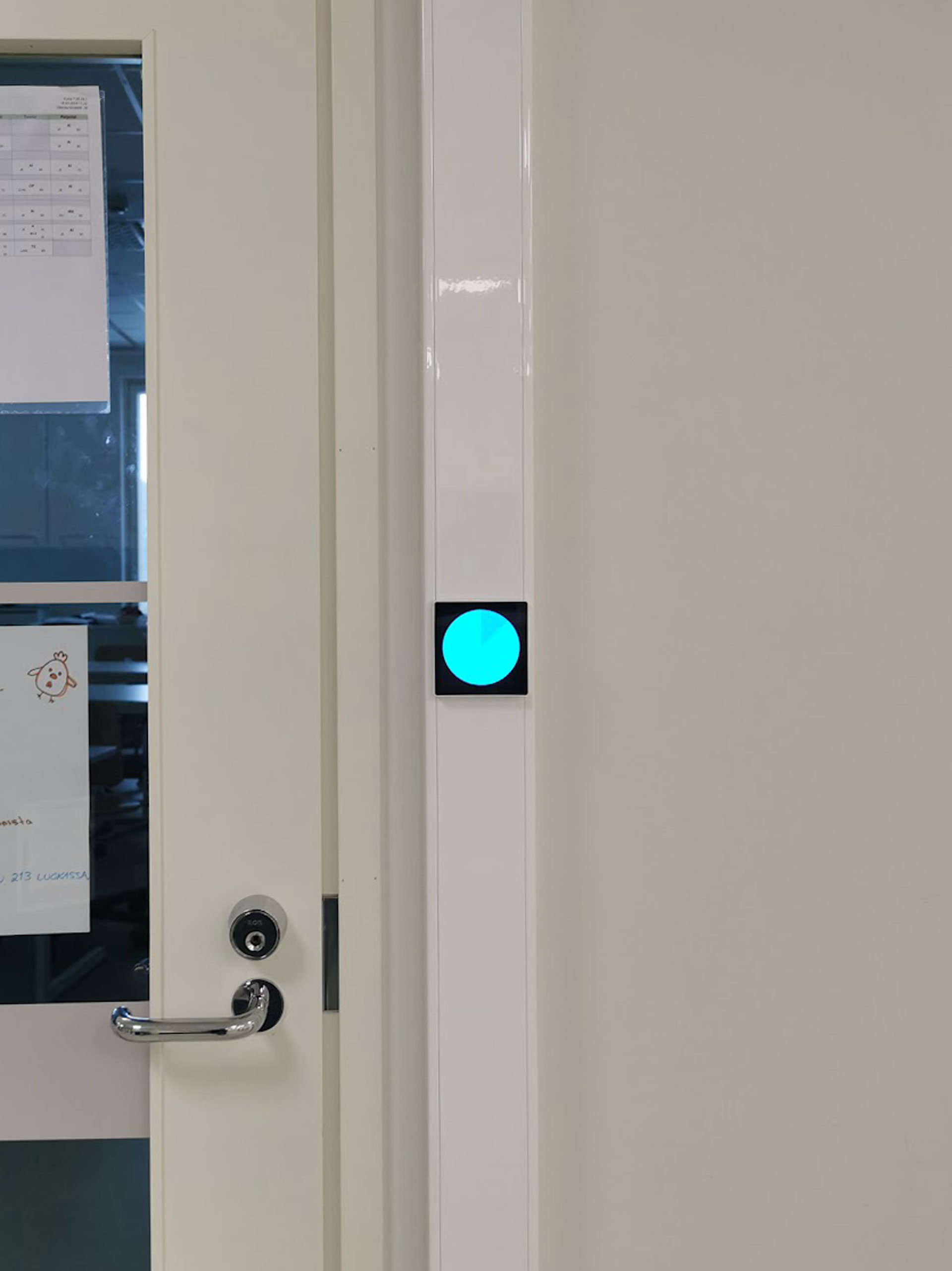 Touchscreen with a light blue circle in hallway